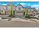 View of townhouses with well-maintained lawns and driveways, showcasing the neighborhood's curb appeal at 409 Retreat Ln, Canton, GA 30114