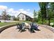 Inviting community firepit with seating, nestled among trees, with nearby homes and relaxing swing at 409 Retreat Ln, Canton, GA 30114