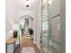 Bright foyer with hardwood floors, an elegant console table and a staircase leading to the upper level at 409 Retreat Ln, Canton, GA 30114