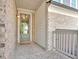 Inviting front porch with brick accents and a charming entryway, perfect for welcoming guests at 409 Retreat Ln, Canton, GA 30114