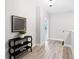 Hallway features wood floors and stylish console table at 409 Retreat Ln, Canton, GA 30114