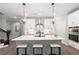Stylish kitchen featuring quartz countertops, stainless steel appliances, and a center island with seating at 409 Retreat Ln, Canton, GA 30114