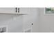 Functional laundry room with white cabinets and a view at 409 Retreat Ln, Canton, GA 30114