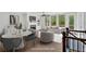 Bright living room with ample seating, fireplace, and natural light, enhanced with virtual staging at 409 Retreat Ln, Canton, GA 30114