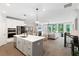 Spacious living space with a modern kitchen, dining area, living room and beautiful hardwood floors throughout at 409 Retreat Ln, Canton, GA 30114