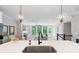 Open-concept living space with a kitchen island, fireplace, comfortable seating and plenty of natural light at 409 Retreat Ln, Canton, GA 30114