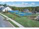 Community pickleball courts featuring multiple blue and green courts, perimeter fencing, and a covered gazebo at 409 Retreat Ln, Canton, GA 30114
