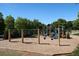 Community playground featuring swings and play set surrounded by trees and fresh air at 409 Retreat Ln, Canton, GA 30114