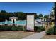 Community pool area including a large swimming pool, lounge chairs, and a lifeguard stand at 409 Retreat Ln, Canton, GA 30114