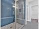 Walk-in shower features elegant tile work and a built-in bench at 409 Retreat Ln, Canton, GA 30114