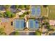 Aerial view of the community tennis courts including three courts, a seating area, and parking at 409 Retreat Ln, Canton, GA 30114
