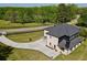 Aerial view of the residence with a large, private driveway and expansive green space at 4881 Bill Cheek Rd, Auburn, GA 30011