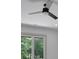 Bedroom featuring a ceiling fan and a window with a view of mature trees at 4881 Bill Cheek Rd, Auburn, GA 30011