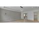 Spacious bedroom features paneled walls, modern lighting, and an attached bathroom and laundry room at 4881 Bill Cheek Rd, Auburn, GA 30011