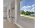 Bright walk-in closet features custom shelving, rods, and scenic window view at 4881 Bill Cheek Rd, Auburn, GA 30011