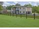 Two-story home with a black fenced-in yard, offering privacy at 4881 Bill Cheek Rd, Auburn, GA 30011