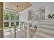 Bright foyer featuring a modern staircase, large windows, and high ceilings at 4881 Bill Cheek Rd, Auburn, GA 30011