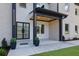 Inviting home entrance featuring a double glass door and accent lighting at 4881 Bill Cheek Rd, Auburn, GA 30011