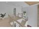 Bright hallway features wood floors, wood and metal banisters, a modern light fixture, and an open staircase at 4881 Bill Cheek Rd, Auburn, GA 30011