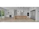 Modern kitchen with white cabinets, stainless steel appliances, and a large center island at 4881 Bill Cheek Rd, Auburn, GA 30011