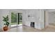 Bright living room featuring a bar with a wine cooler, white cabinets, and a large window with an outdoor view at 4881 Bill Cheek Rd, Auburn, GA 30011
