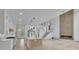 Open-concept with kitchen, grand staircase, and a fireplace feature wall at 4881 Bill Cheek Rd, Auburn, GA 30011