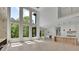 Bright living room with hardwood floors, fireplace, and large windows at 4881 Bill Cheek Rd, Auburn, GA 30011