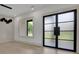 Bright living room with modern light fixtures and a unique wall design at 4881 Bill Cheek Rd, Auburn, GA 30011