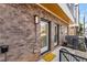 Charming front entrance features brick facade, a welcoming 'hello' mat, and modern exterior lighting at 1237 Memorial Se Dr # 302, Atlanta, GA 30316