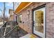 Charming brick home exterior featuring a modern door, visible address, and metal railing at 1237 Memorial Se Dr # 302, Atlanta, GA 30316
