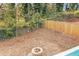 Spacious backyard featuring a charming stone fire pit, perfect for outdoor gatherings and relaxation at 1316 Plaza Sw Ave, Atlanta, GA 30310