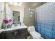 Bathroom featuring a vanity with a sink and patterned shower curtain at 1316 Plaza Sw Ave, Atlanta, GA 30310