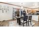 Cozy dining area featuring hardwood floors, modern lighting, and backyard view at 1316 Plaza Sw Ave, Atlanta, GA 30310