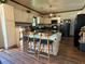 Eat-in kitchen with granite countertops, stainless appliances and center island with bar stool seating at 1316 Plaza Sw Ave, Atlanta, GA 30310