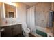 Bathroom with modern vanity, white marble shower, and decor at 1412 Shelnutt Ct, Hampton, GA 30228