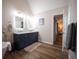 Lovely bathroom featuring walk-in shower, soaking tub, double sink vanity, and modern flooring at 1412 Shelnutt Ct, Hampton, GA 30228