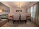 Formal dining room features neutral colors, decorative lighting, and seating for six, perfect for Gathering gatherings at 1412 Shelnutt Ct, Hampton, GA 30228