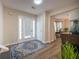 Bright foyer features a tiled floor, front door with sidelights, and elegant decor at 1412 Shelnutt Ct, Hampton, GA 30228