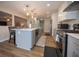 Modern kitchen with gray and white cabinets, stainless steel appliances, hardwood flooring, and marble countertops at 1412 Shelnutt Ct, Hampton, GA 30228