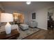Comfortable living room with a view into the dining room, perfect for entertaining at 1412 Shelnutt Ct, Hampton, GA 30228