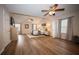 Spacious main bedroom featuring modern flooring, ceiling fans, natural light, and comfortable sitting area at 1412 Shelnutt Ct, Hampton, GA 30228
