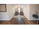 Cozy sitting area featuring modern floors, neutral tones, natural light, and two comfortable chairs at 1412 Shelnutt Ct, Hampton, GA 30228