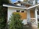 A two-story house with white siding, boarded windows, and a covered porch at 29 Park Ne Cir, Atlanta, GA 30305