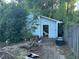 Shed in disrepair with debris and tires, showing deferred maintenance at 29 Park Ne Cir, Atlanta, GA 30305