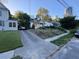The house is on a hill with a driveway and skyline views in the background at 29 Park Ne Cir, Atlanta, GA 30305