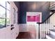 Open foyer with hardwood floors leading to a brightly painted room at 3485 Aubusson Trce, Johns Creek, GA 30022