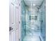 Modern shower with marble tile and glass door for an elegant spa-like experience at 3485 Aubusson Trce, Johns Creek, GA 30022