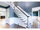 Hardwood staircase featuring a stained handrail and white wooden accents at 3485 Aubusson Trce, Johns Creek, GA 30022
