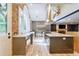 Gourmet kitchen boasts stainless steel appliances, a large island, quartz countertops, and brick wall at 3485 Aubusson Trce, Johns Creek, GA 30022