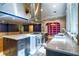Spacious kitchen with stainless appliances, island with cooktop, and bright natural light at 3485 Aubusson Trce, Johns Creek, GA 30022